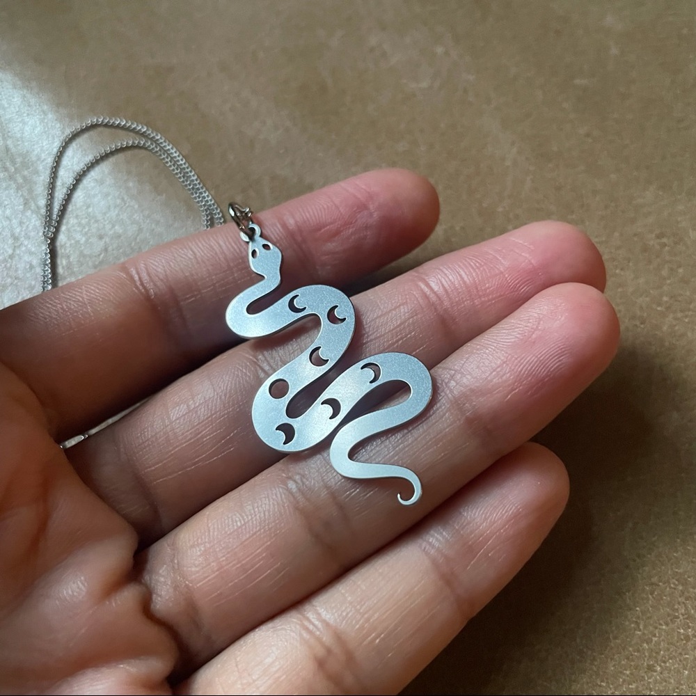 Snake charm pendant necklace
